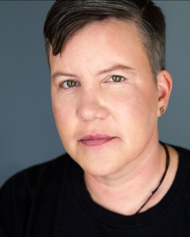 A picture of Karen O'Leary, a woman with short dark blond hair. Picture taken from:https://www.imdb.com/name/nm6166307/?ref_=tt_cl_i_10