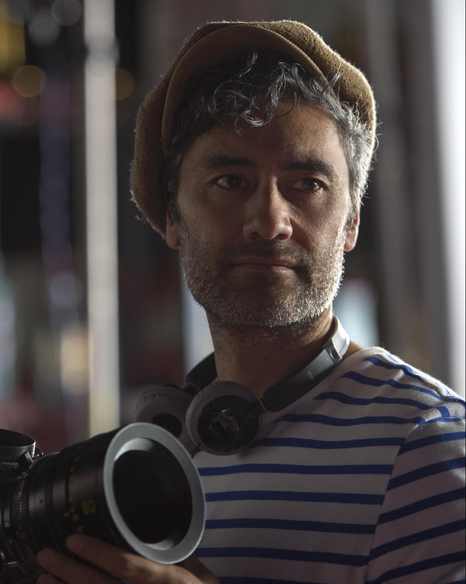 A picture of Taika Waititi, a man with grey curly hair and short beard. Picture taken from:https://www.imdb.com/name/nm0169806/?ref_=tt_cl_t_2
